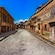 An empty street lined with ancient Roman ruins